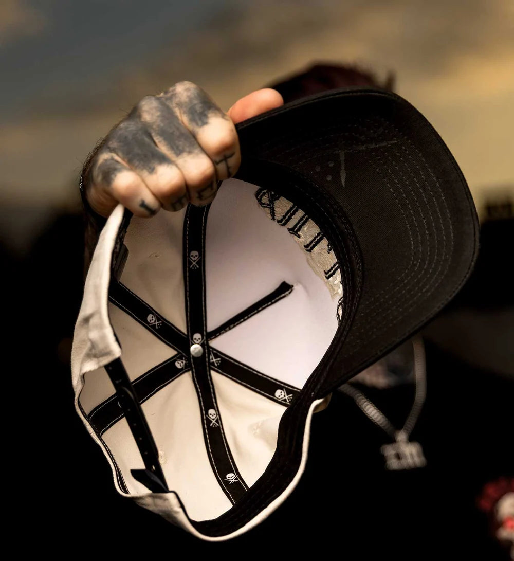 PLEASURES SNAPBACK